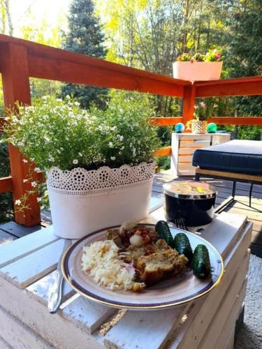 a plate of food on a table with vegetables at In The Woods - Dom z jacuzzi w środku Puszczy Knyszyśnkiej in Supraśl