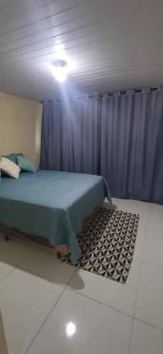 En eller flere senge i et værelse på Lar da praia