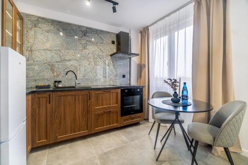 Η κουζίνα ή μικρή κουζίνα στο Apartament w centrum PW Invest Home