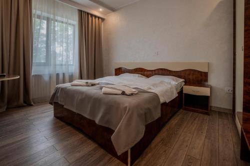 Postel nebo postele na pokoji v ubytování Hotel Emi