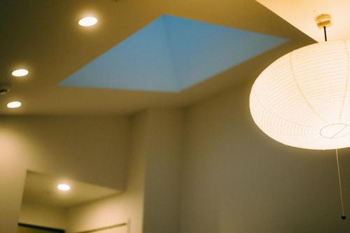 a blue object on the ceiling of a room at THE ROOT2 HOTEL in Kyoto