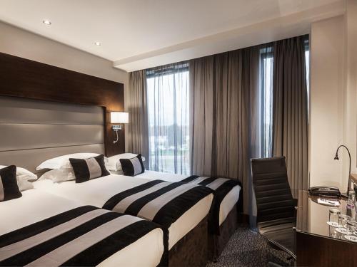 Katil atau katil-katil dalam bilik di Park Grand Heathrow
