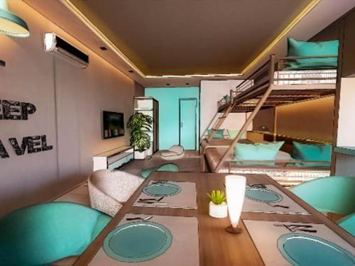 a room with a table and a bunk bed at TABINA HOSTEL - Mactan Cebu International Airport in Lapu Lapu City