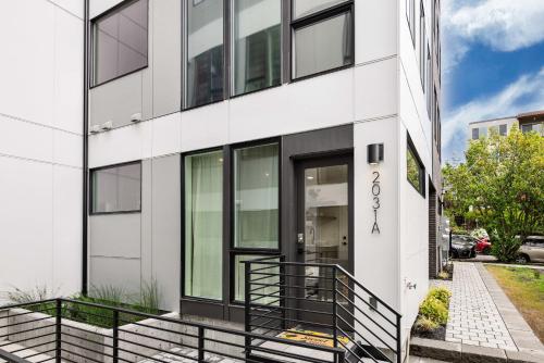 an exterior view of a white building at Brand New Eastlake Studio - SLU UW Shops & Eats in Seattle