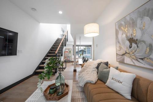 a living room with a couch and a staircase at Queen Anne Modern Family Home Free Parking - SLU - Gym in Seattle