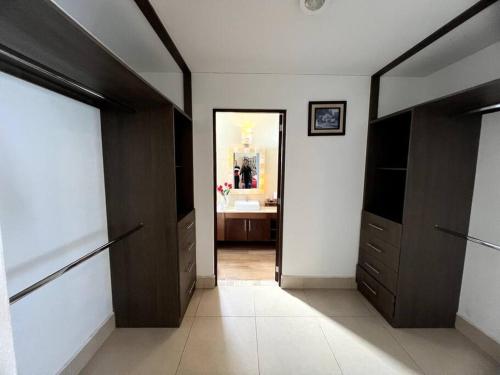 a hallway with two doors and a bathroom with a sink at Casa Tabita in Dolores