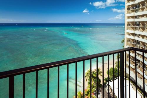 a view of the ocean from a balcony of a condo at Sheraton Waikiki Beach Resort in Honolulu