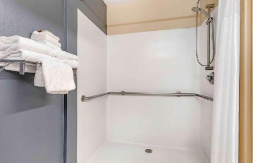 a bathroom with a shower with white towels at Extended Stay America Suites - Fort Worth - City View in Fort Worth