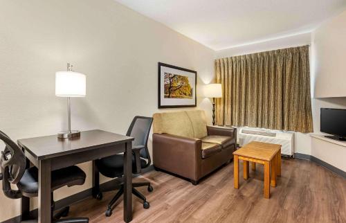 a hotel room with a desk and a chair at Extended Stay America Suites - Cincinnati - Blue Ash - Reed Hartman in Blue Ash