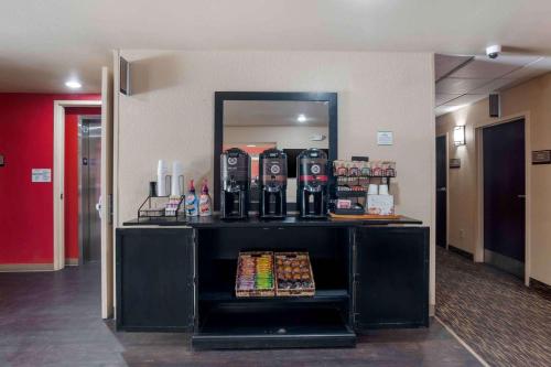 a drink stand in a lobby with a mirror at Extended Stay America Suites - Orange County - Lake Forest in Foothill Ranch