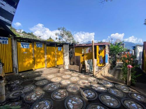 a building with a bunch of tires in front of it at Gran Colibrí Adventure Park in San Pedro La Laguna