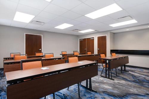 a classroom with desks and chairs in a room at Fairfield Inn and Suites by Marriott Rochester West/Greece in Rochester
