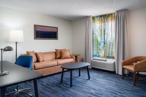 a living room with a couch and a window at Fairfield Inn and Suites by Marriott Birmingham / Bessemer in Bessemer