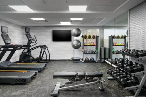 a gym with several tread machines and a flat screen tv at Fairfield Inn and Suites by Marriott Birmingham / Bessemer in Bessemer