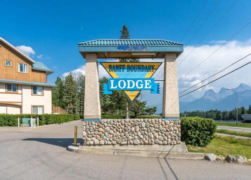 a welcome sign for a lodge in a parking lot at Entire Lovely Townhouse Mountain View! in Canmore