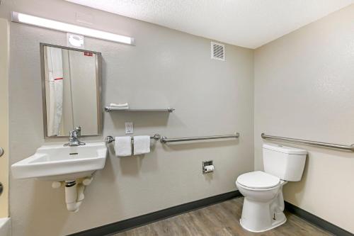a bathroom with a toilet and a sink at Red Roof Inn Washington DC - Laurel in Laurel