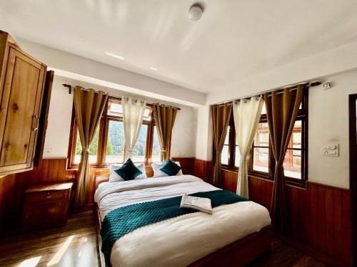 Hotel Norbu Khangsarにあるベッド