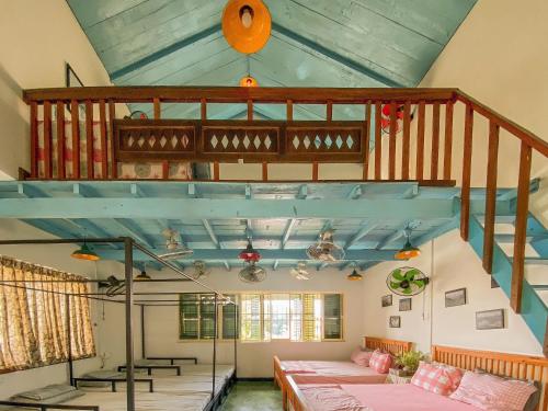 a room with a loft with a bed and a staircase at Homestay in Tay Ninh in Tây Ninh
