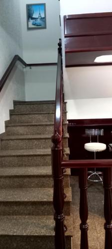 a staircase with a piano in a room at Hostel Blaese Pascal - HBP in Guarulhos
