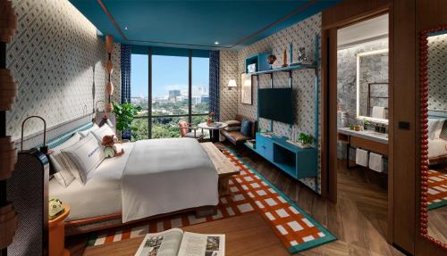Una cama o camas en una habitación de 25hours Hotel Jakarta The Oddbird