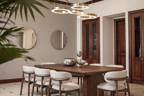 a dining room with a wooden table and chairs at JW Marriott Quito in Quito