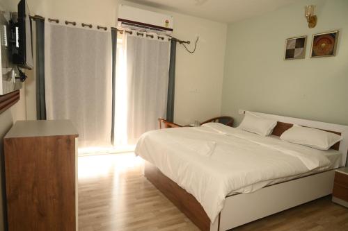 a bedroom with a large bed and a window at shangrila stay in Bodh Gaya