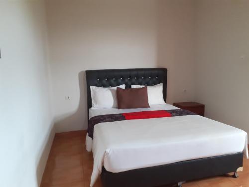 Cama ou camas em um quarto em Griya Bun Sari