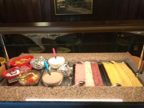a tray of food on top of a counter at Hotel Zelený Dům in Boží Dar