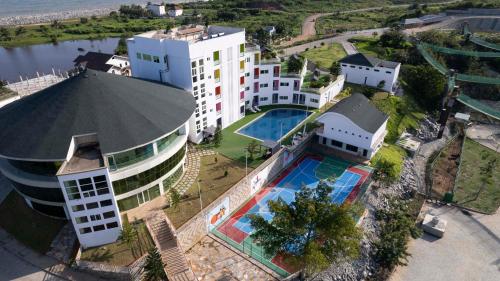 an aerial view of a building with a swimming pool at The Grove Essipong Beach Resort in Inchaban