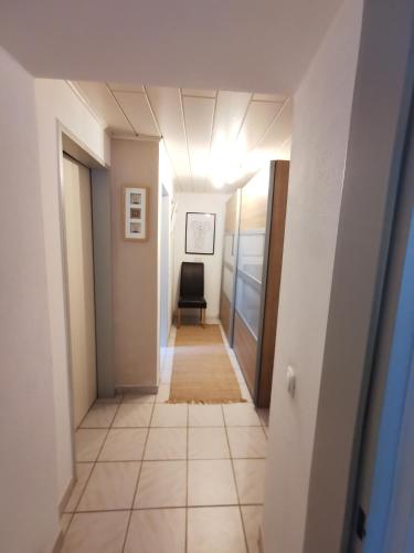 a hallway with a room with a chair in it at Ferienwohnung in Grünbach bei Freistadt in Grünbach