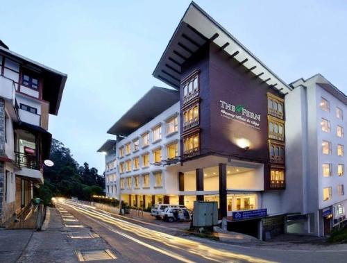 a building with a car parked in front of it at The Fern Denzong Hotel & Spa Gangtok, Sikkim in Gangtok