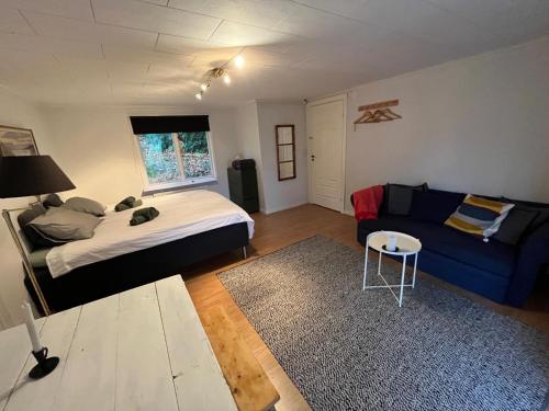 Кровать или кровати в номере Magnoliabackens Bed and Breakfast