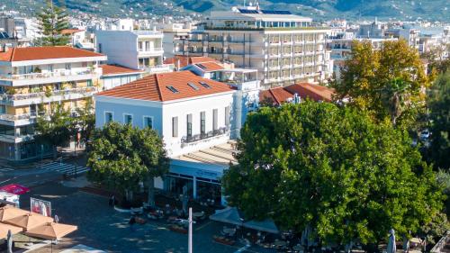 an overhead view of a city with buildings and trees at Panellinion Luxury Rooms in Kalamata