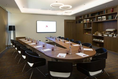 a large conference room with a long table and chairs at Skopje Marriott Hotel in Skopje