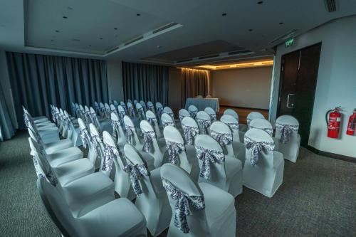 a room with rows of chairs in a conference room at Sofia Colombo City Hotel in Colombo