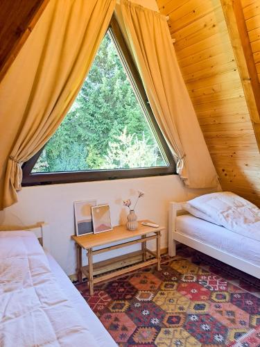 Postel nebo postele na pokoji v ubytování Forest House Bukva