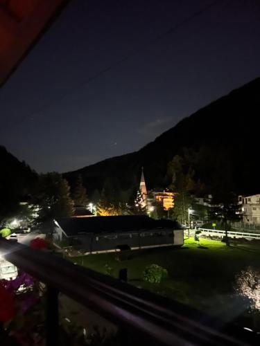 a view of a city at night at AKY Residence in Slănic-Moldova