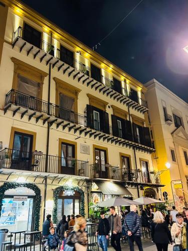 a group of people walking in front of a building at Spera Luxury Palermo & SPA in Palermo