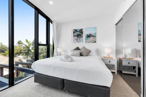 En eller flere senge i et værelse på Coastal Escape in Broadbeach