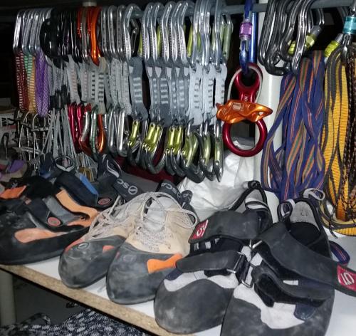 a group of shoes and other items on a shelf at Trafo Base Camp in Kroczyce