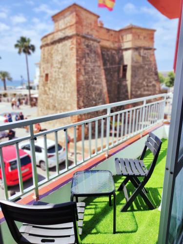 two chairs and a bench on a balcony at Los Deseos De Vera in La Cala de Mijas
