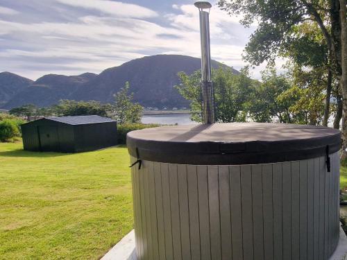 a large trash can sitting on the side of a field at Haus Soltun-Was will man mehr! in Runde