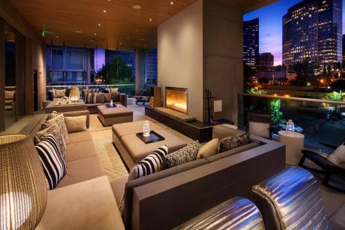 a hotel lobby with couches and a fireplace at W Bellevue in Bellevue