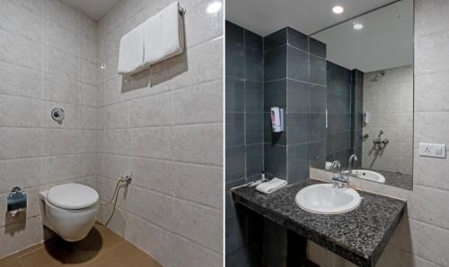 a bathroom with a toilet and a sink at Hotel Chandigarh Grand and Banquet in Manī Mājra