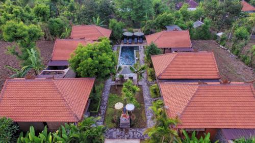 an aerial view of a house with red roofs at Global Royal Pemuteran in Pemuteran