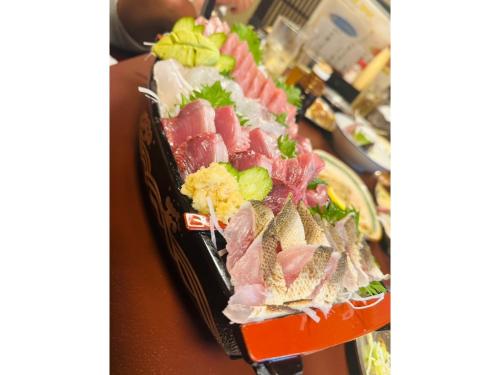 a tray filled with different types of food on a table at OCEAN FRONT TATEYAMA - Vacation STAY 35718v in Tateyama