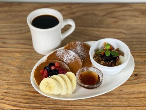 a plate of food with a cup of coffee and a plate of pastries at OCEAN FRONT TATEYAMA - Vacation STAY 35718v in Tateyama