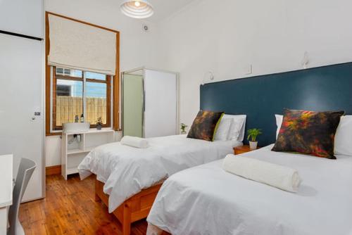 Кровать или кровати в номере At South Boutique Guesthouse