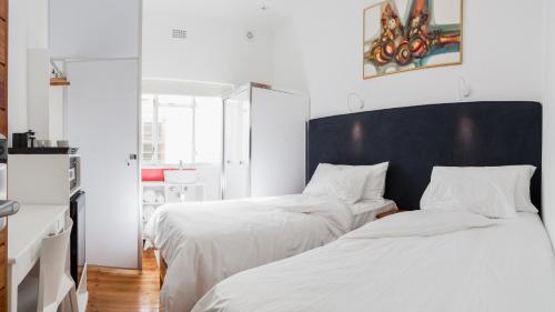 Кровать или кровати в номере At South Boutique Guesthouse