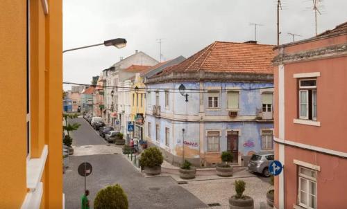 a view of a city street with buildings at Suites & Apartments DP VFXira in Vila Franca de Xira
